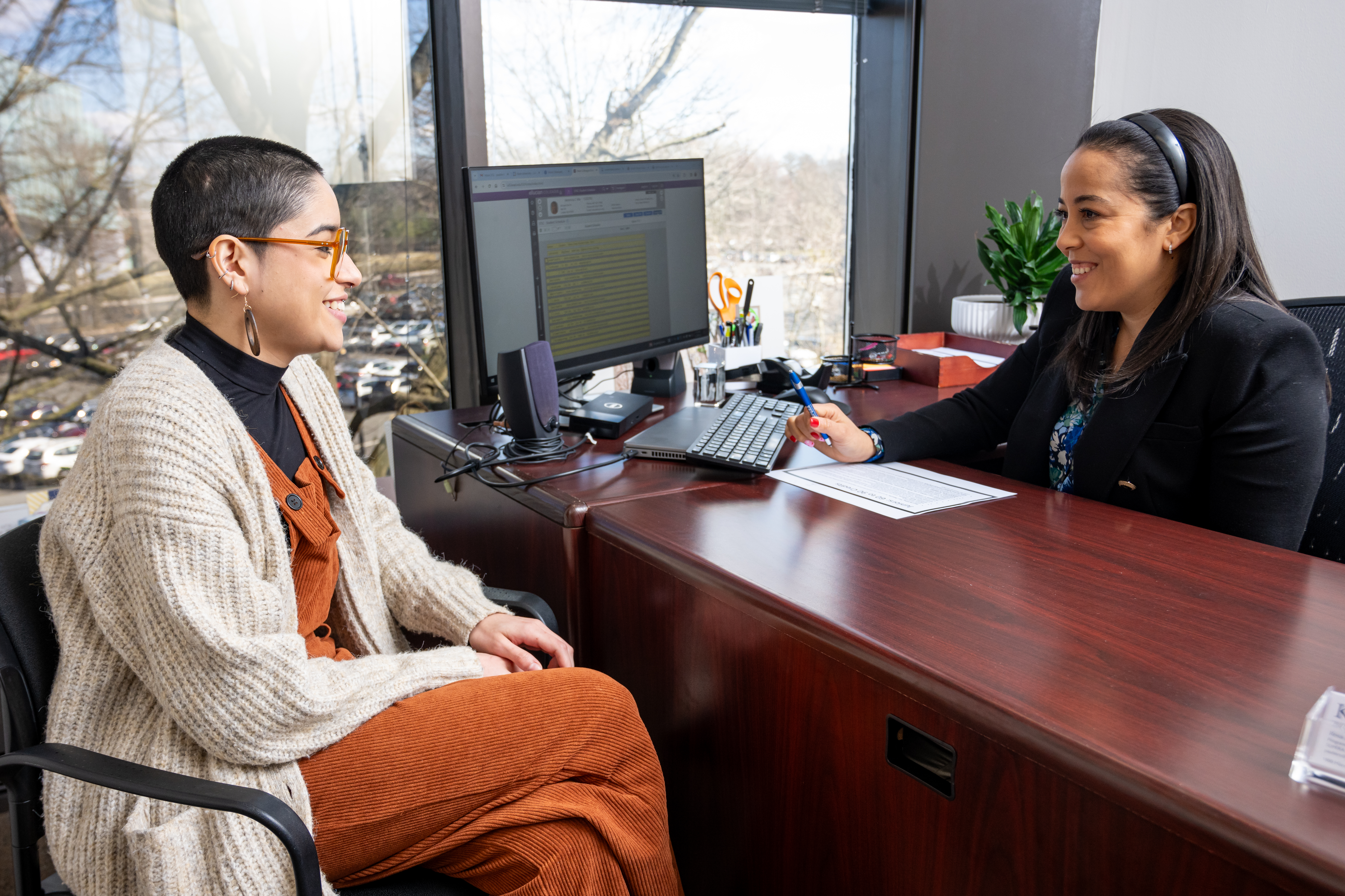 A guidance counselor meets with a student