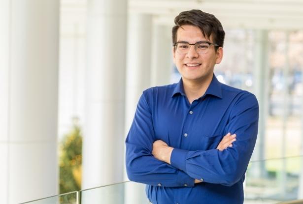 Victor Suarez standing with arms crossed