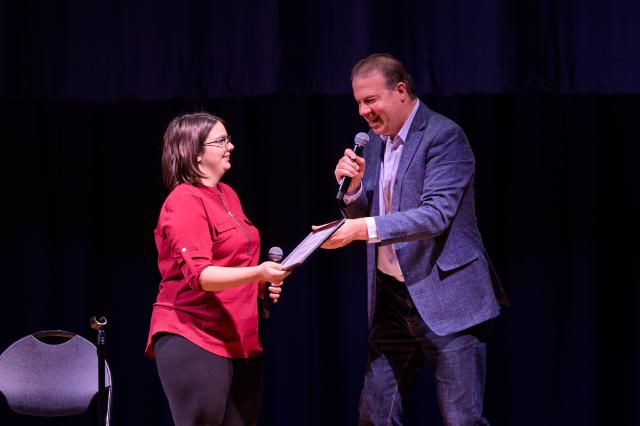 Premiere Stages Producing Artistic Director John J. Wooten presents award to Kean student Emily Niemeyer.