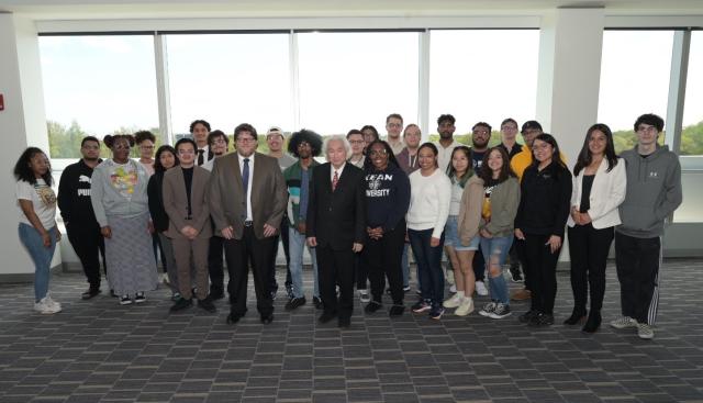 Michio Kaku, Ph.D. group shot with students at STEM