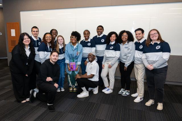 Tabitha Brown with a group of Kean students in a classroom