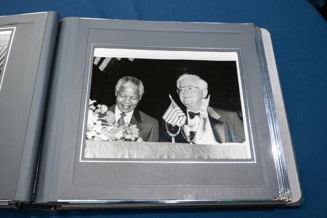 A page from the photo album shows Nelson Mandela and Patrick J. Ward.