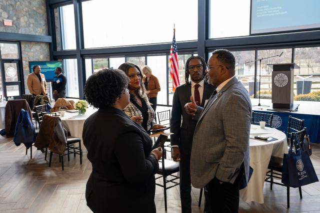 President Repollet speaks with attendees at the Building for Growth kickoff