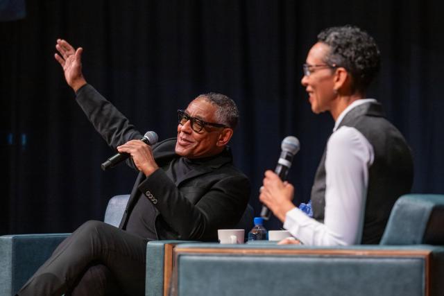 Giancarlo Esposito speaks enthusiastically during Distinguished Lecture