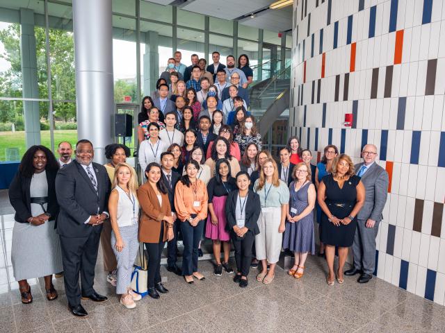 A group shot of new faculty and some Kean administrators at STEM atrium