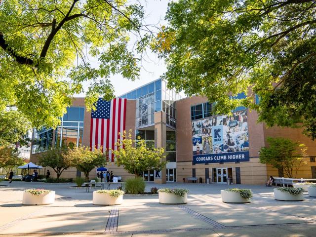 Miron Student Center at Kean University in the summer, surrounded by trees.