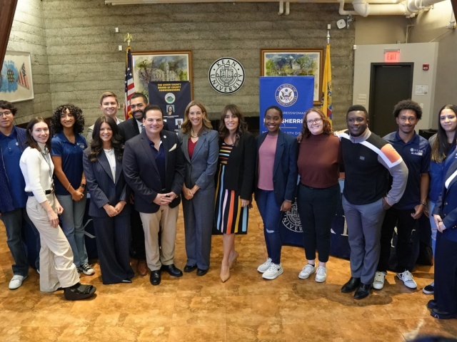 Rep. Sherill, Senators Scutari and Ruiz, and Commissioner Granados pose in Kean Hall with Kean University students.