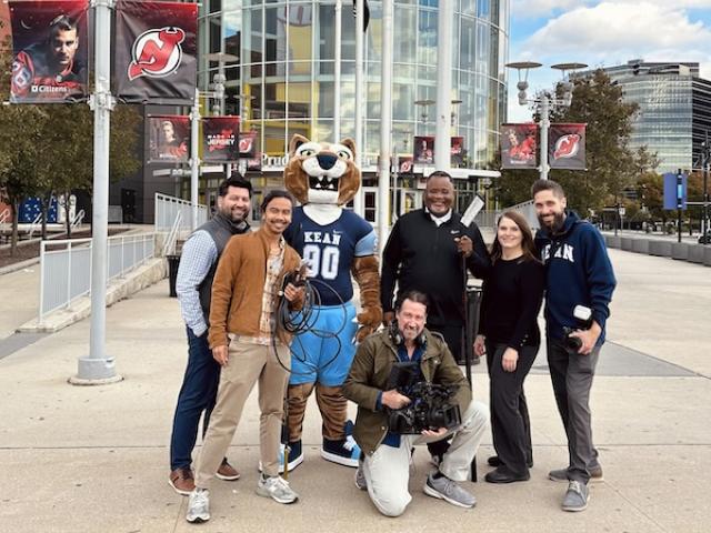 The Kean multimedia team at Devils stadium with Kean President Lamont O. Repollet