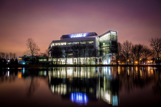 Kean's STEM building at dusk from across the pond