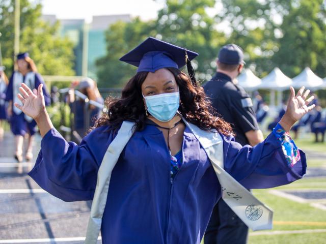 Student walking to the stage at 2020 commencement 