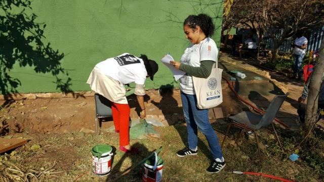 Kean student Natalie Hernández interviews a volunteer in South Africa.