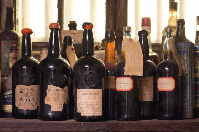 Hand written tags and labels adorned the fine of ancient Madeira wine