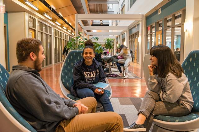 Kean students laughing in the CAS lobby