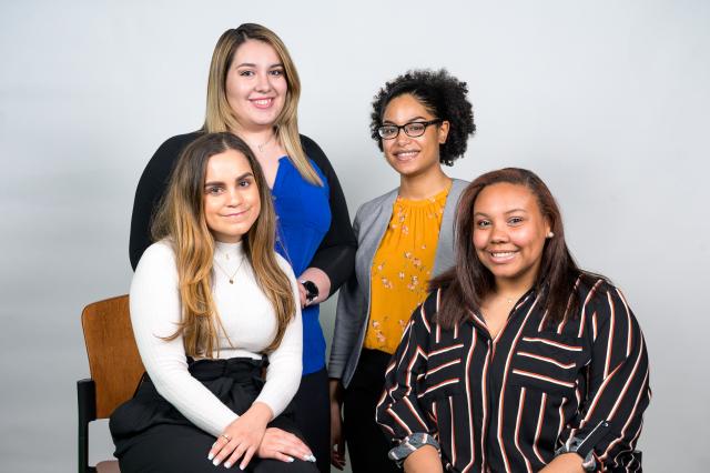 Four young woman pose