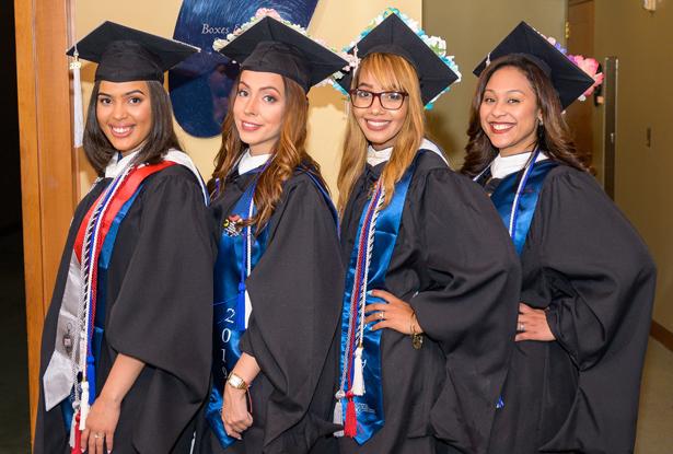 Four women graduating from Kean University's Nathan Weiss Graduate Program pose together.