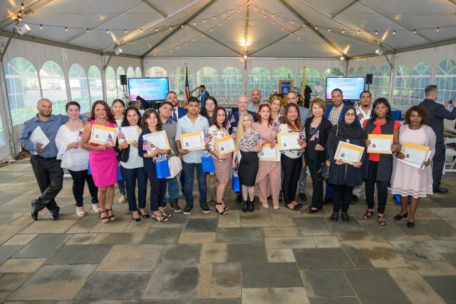 A group of new American citizens at their naturalization ceremony, held at Kean University.