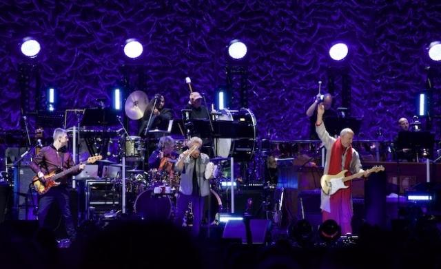 Rock band The Who on stage at MSG. Pete Townshend is seen doing signature move. Kean Adjunct James Musto III plays percussion in the background.