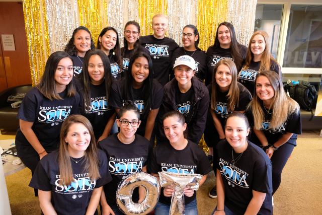 A few of Kean University's Occupational Therapy students pose for a picture during the Student Occupational Therapy Association's (SOTA) Older Adult Prom.