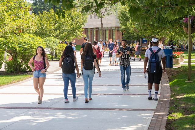 Kean students stroll down Cougar Walk. 