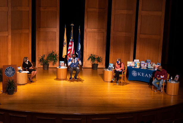 Sancha Gray, Dr. Repollet, Randi Weingarten and Ras Baraka, wearing face masks, sit on stage at Enlow Recital Hall.