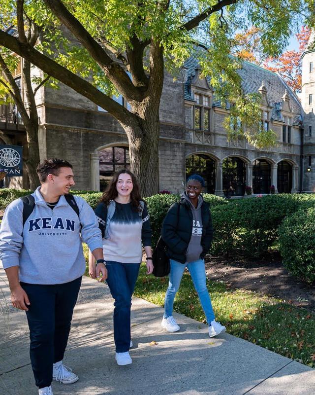 Three students walking together on Kean campus