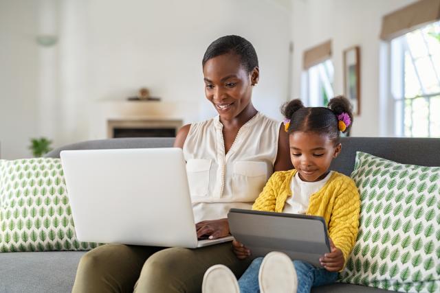 Kean Global student studies at home with her child