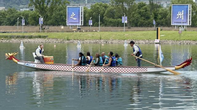 A dragon boat, a long, canoe-like boat with a dragon head at the front, in China