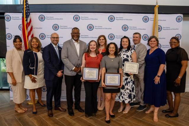 Kean President Repollet and education officials pose with the student intern award winners.