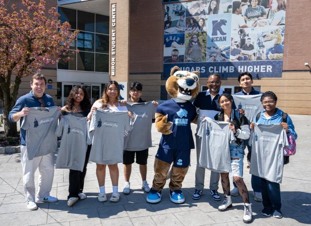 Dr. Repollet with Kean Foundation CEO Bill Miller and Kean students at Kean's Founders Day