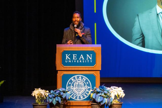 Ndaba Mandela speaks at a podium at Kean University