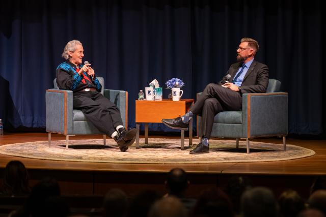 Temple Grandin and James Konopack seated in chairs on the stage, having a Q and A