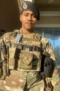 Jeremiah Renvill in military uniform standing in front of building.